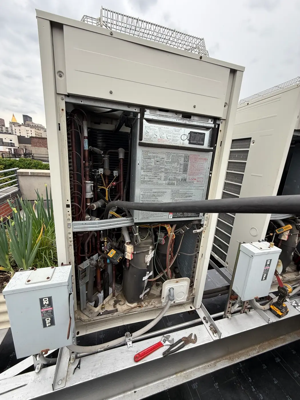 Diagnosing a commercial rooftop unit with the service panel open