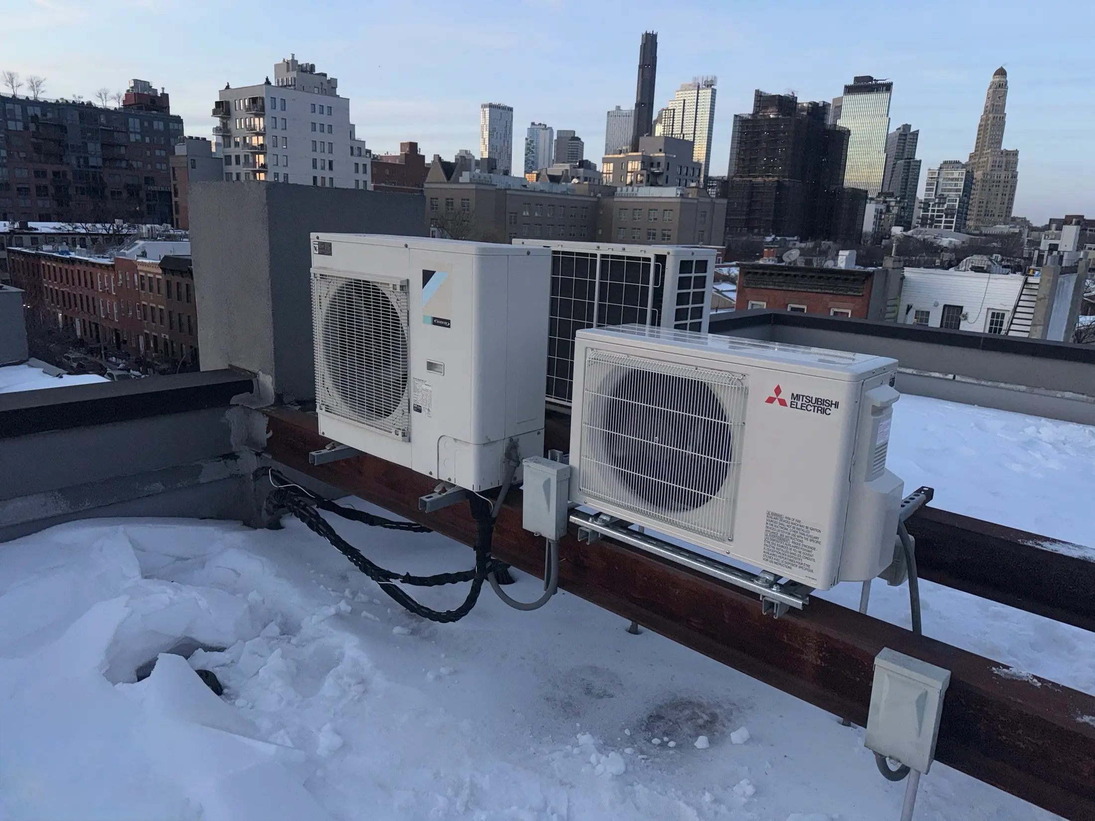 Rooftop AC condensers installed by YATSON against the New York skyline
